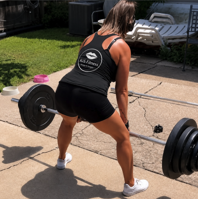 Michelle Long setting up for a barbell deadlift outdoors in St. Louis
